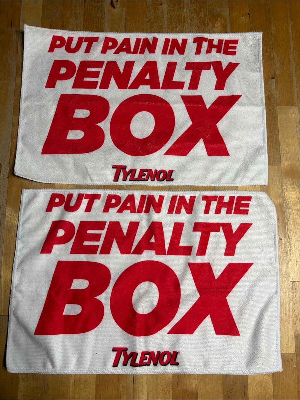 Pair of Tylenol 'Put Pain in the Penalty Box' Promotional Rally Towels -